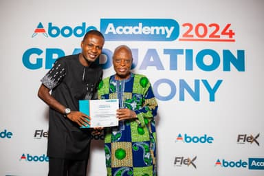 Associates celebrating with a certificate